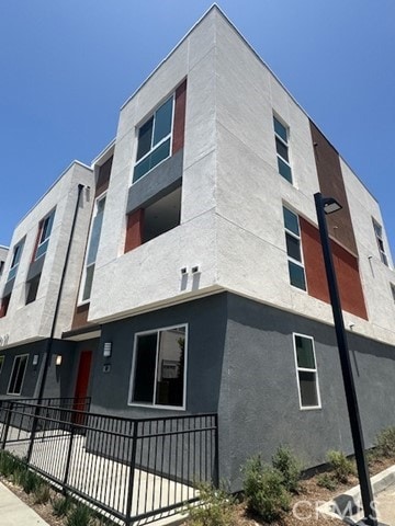 1810 E 1st St Unit 170, Santa Ana, CA 92705 - view of home's exterior featuring stucco siding