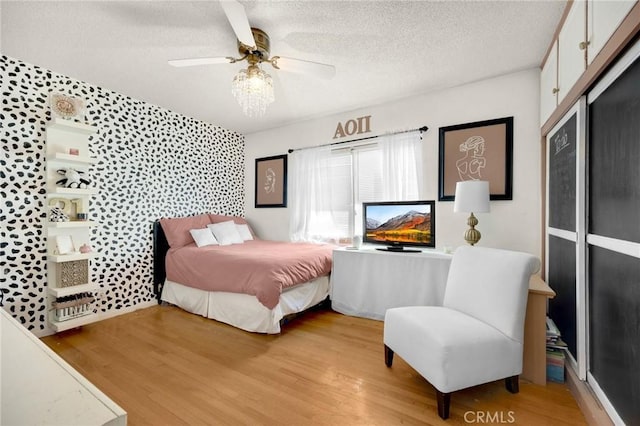 15902 Santa Fe St, Whittier, CA 90603 - bedroom featuring light wood-type flooring, a textured ceiling, and ceiling fan