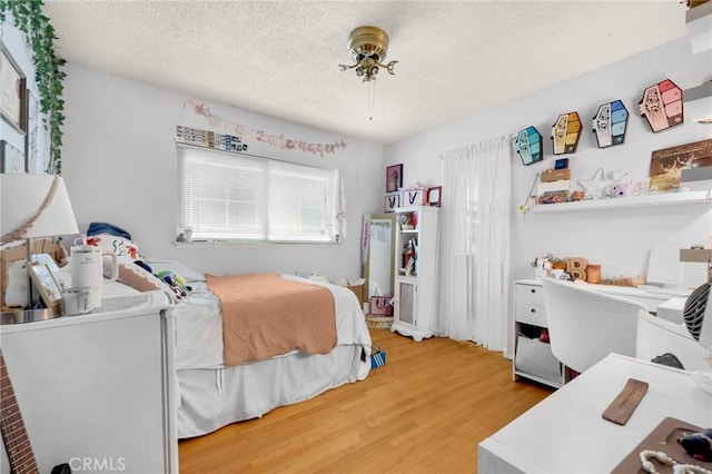 15902 Santa Fe St, Whittier, CA 90603 - bedroom with wood finished floors and a textured ceiling