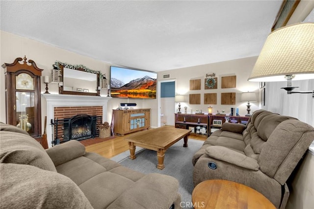 15902 Santa Fe St, Whittier, CA 90603 - living room featuring wood finished floors and a brick fireplace