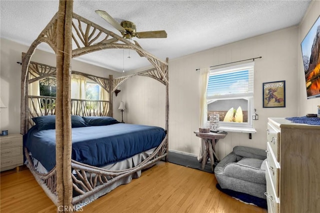 15902 Santa Fe St, Whittier, CA 90603 - bedroom featuring wood finished floors, a textured ceiling, and ceiling fan