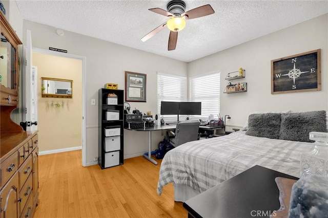 15902 Santa Fe St, Whittier, CA 90603 - bedroom featuring light wood-style flooring, a textured ceiling, a desk, and a ceiling fan