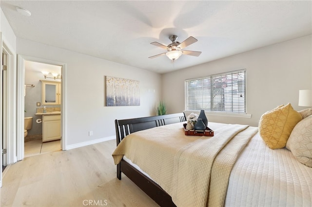 19615 E Tudor St, Covina, CA 91724 - bedroom featuring light wood finished floors, ensuite bath, and a ceiling fan