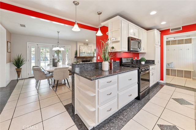 19615 E Tudor St, Covina, CA 91724 - kitchen with appliances with stainless steel finishes, open shelves, recessed lighting, white cabinetry, and pendant lighting