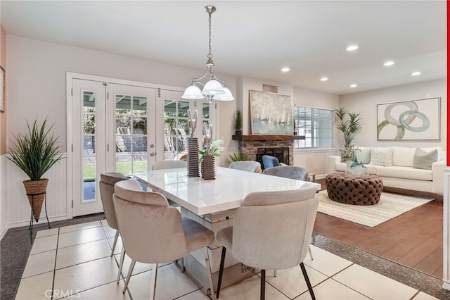 19615 E Tudor St, Covina, CA 91724 - dining room with recessed lighting, french doors, light tile patterned flooring, and a fireplace