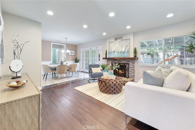 19615 E Tudor St, Covina, CA 91724 - living area featuring recessed lighting, hardwood / wood-style floors, plenty of natural light, a fireplace, and french doors