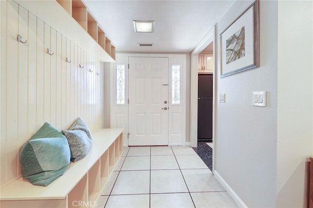 19615 E Tudor St, Covina, CA 91724 - mudroom with light tile patterned floors and baseboards