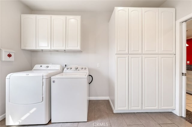 19615 E Tudor St, Covina, CA 91724 - laundry area with cabinet space, washer and clothes dryer, and light tile patterned floors