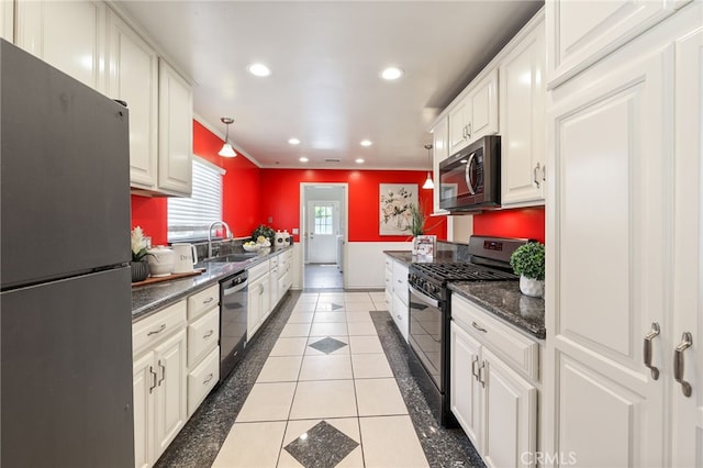 19615 E Tudor St, Covina, CA 91724 - kitchen with freestanding refrigerator, range with gas stovetop, stainless steel microwave, dishwashing machine, and dark countertops