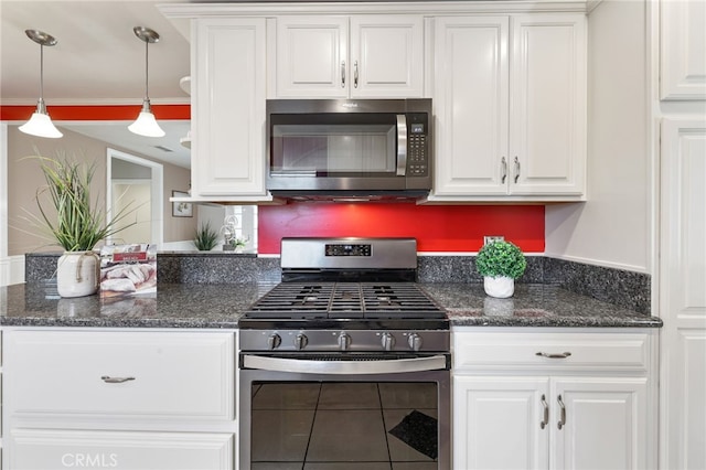 19615 E Tudor St, Covina, CA 91724 - kitchen featuring stainless steel appliances, white cabinetry, decorative light fixtures, and dark stone counters