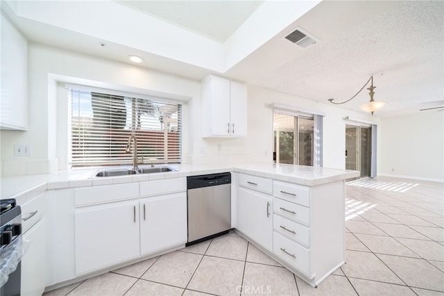 11500 Winery Dr, Fontana, CA 92337 - kitchen with dishwasher, a peninsula, light tile patterned flooring, white cabinets, and recessed lighting