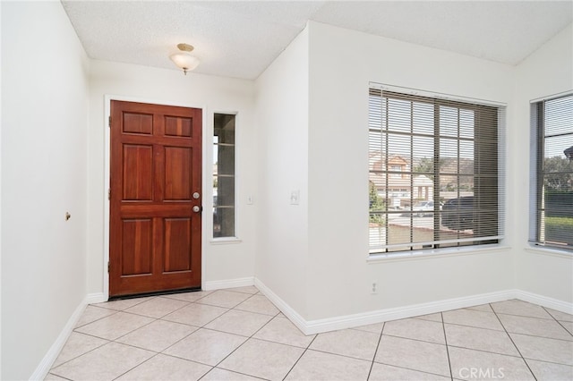 11500 Winery Dr, Fontana, CA 92337 - foyer entrance with light tile patterned floors and baseboards