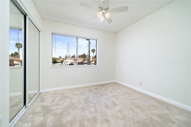 11500 Winery Dr, Fontana, CA 92337 - carpeted empty room with baseboards and ceiling fan