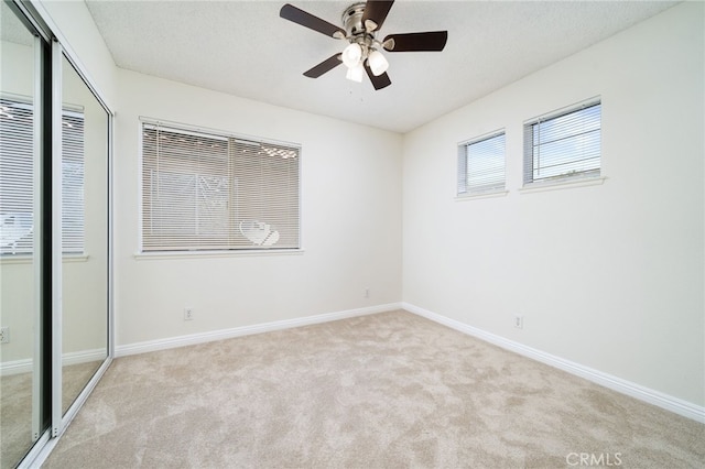 11500 Winery Dr, Fontana, CA 92337 - unfurnished bedroom featuring carpet, a closet, and a ceiling fan