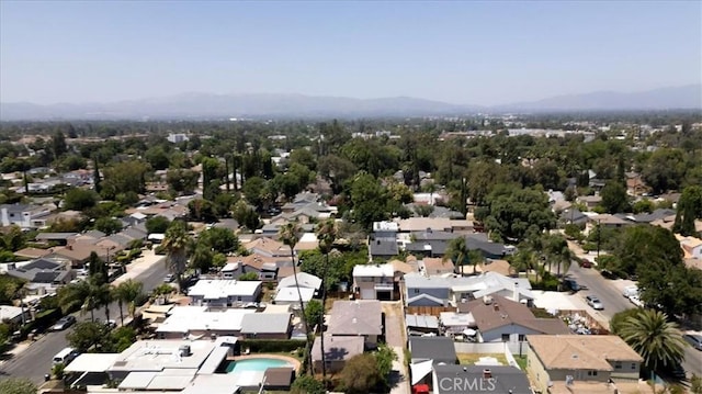 18713 Vanowen St, Reseda, CA 91335 - aerial view of property and surrounding area with mountains and nearby suburban area