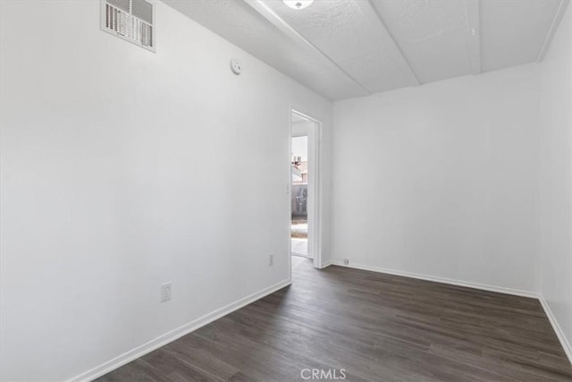 18713 Vanowen St, Reseda, CA 91335 - empty room featuring dark wood finished floors and a smoke detector