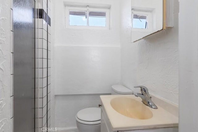 18713 Vanowen St, Reseda, CA 91335 - full bath with vanity, a textured wall, and a shower