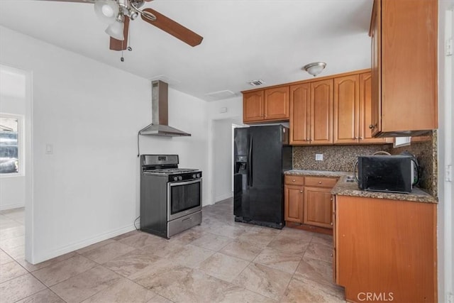 18713 Vanowen St, Reseda, CA 91335 - kitchen with stainless steel gas range oven, wall chimney range hood, black fridge, a ceiling fan, and decorative backsplash