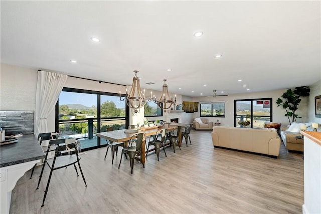 33851 Madera De Playa, Temecula, CA 92592 - dining room featuring healthy amount of natural light, light wood-style floors, recessed lighting, and a chandelier