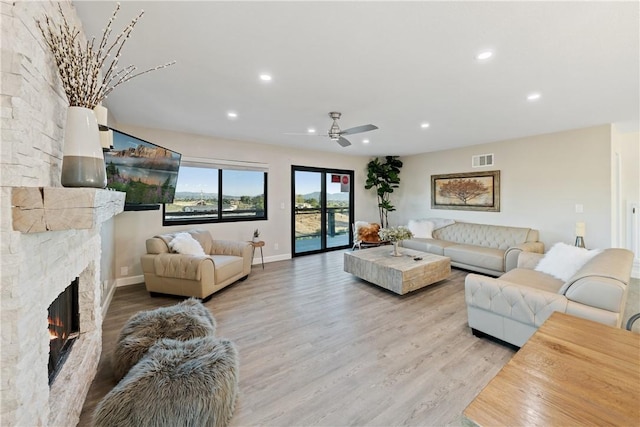 33851 Madera De Playa, Temecula, CA 92592 - living room with ceiling fan, recessed lighting, light wood finished floors, and a fireplace