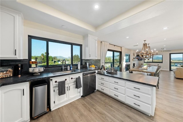 33851 Madera De Playa, Temecula, CA 92592 - kitchen with dishwasher, dark countertops, a peninsula, decorative backsplash, and recessed lighting
