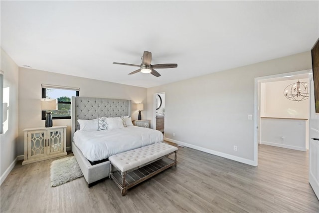 33851 Madera De Playa, Temecula, CA 92592 - bedroom featuring a chandelier, wood finished floors, and a ceiling fan