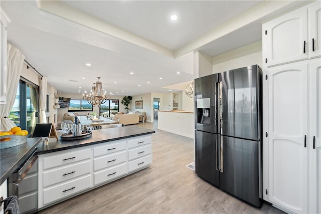 33851 Madera De Playa, Temecula, CA 92592 - kitchen with stainless steel fridge, dark countertops, white cabinets, recessed lighting, and light wood-style floors