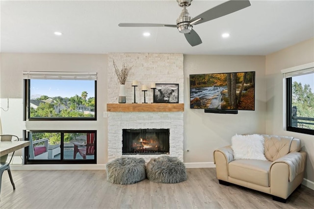 33851 Madera De Playa, Temecula, CA 92592 - living area featuring wood finished floors, a fireplace, recessed lighting, and ceiling fan