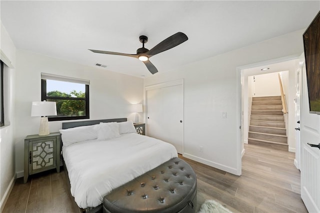 33851 Madera De Playa, Temecula, CA 92592 - bedroom with light wood-type flooring, a ceiling fan, and a closet