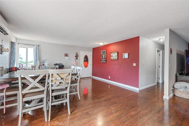 1996 Rainbow Glen Rd, Fallbrook, CA 92028 - dining room with a textured ceiling, wood finished floors, and a wall unit AC