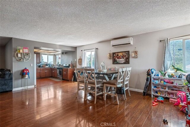 1996 Rainbow Glen Rd, Fallbrook, CA 92028 - dining area with a wall mounted AC, a textured ceiling, and wood finished floors