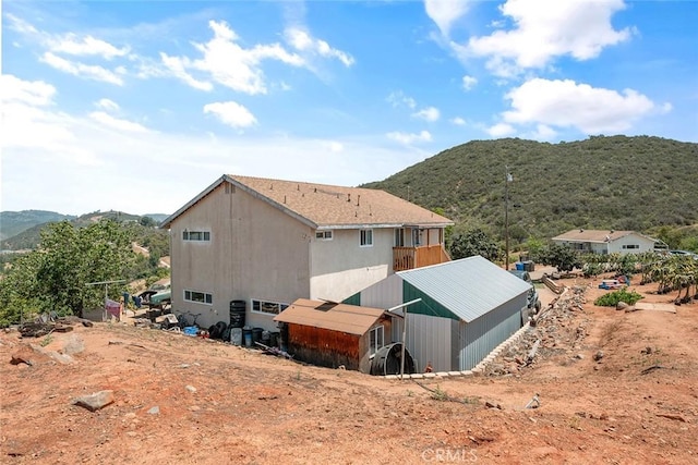 1996 Rainbow Glen Rd, Fallbrook, CA 92028 - back of house featuring a mountain view, a pole building, and an outbuilding