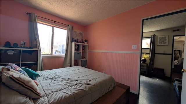 522 S 5th St, Montebello, CA 90640 - bedroom with a textured ceiling and a wainscoted wall