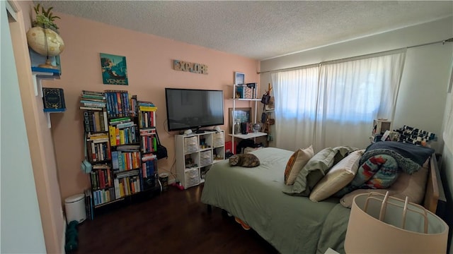 522 S 5th St, Montebello, CA 90640 - bedroom with a textured ceiling and wood finished floors