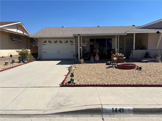 1441 Edgewood Ln, Hemet, CA 92543 - ranch-style house with driveway, an attached garage, and a shingled roof