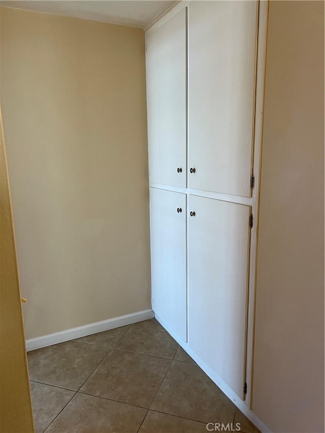 1441 Edgewood Ln, Hemet, CA 92543 - unfurnished bedroom featuring dark tile patterned flooring and a closet