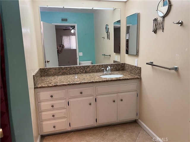 1441 Edgewood Ln, Hemet, CA 92543 - bathroom with ceiling fan, vanity, and tile patterned floors