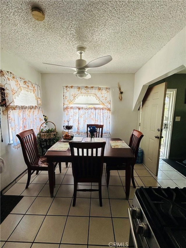 3700 W 105th St, Inglewood, CA 90303 - dining space with plenty of natural light, ceiling fan, light tile patterned floors, and a textured ceiling