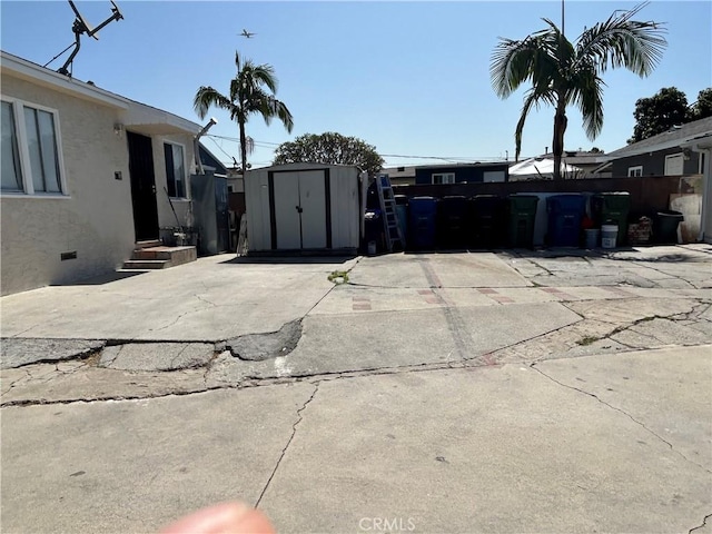 3700 W 105th St, Inglewood, CA 90303 - exterior space with a shed, stucco siding, and crawl space