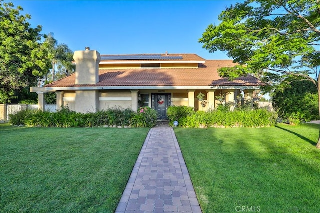 6073 Cameo St, Rancho Cucamonga, CA 91701 - view of front of home with roof mounted solar panels, a front yard, and stucco siding