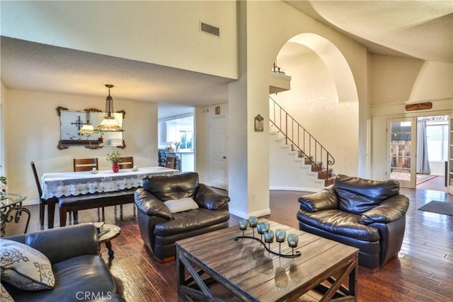 6073 Cameo St, Rancho Cucamonga, CA 91701 - living area with hardwood / wood-style floors, stairs, a high ceiling, and arched walkways