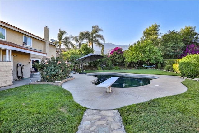 6073 Cameo St, Rancho Cucamonga, CA 91701 - view of pool with a patio, a yard, and a diving board