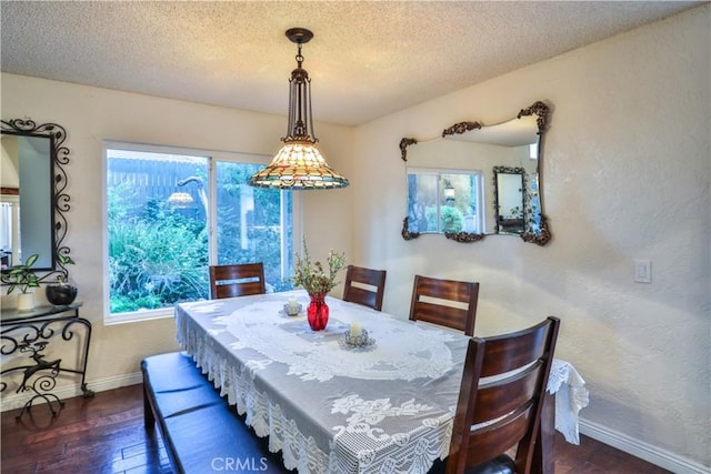 6073 Cameo St, Rancho Cucamonga, CA 91701 - dining area featuring dark wood-style floors, a textured wall, and a textured ceiling