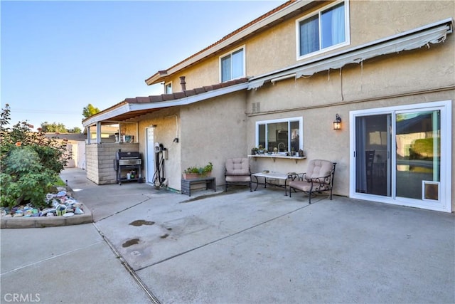 6073 Cameo St, Rancho Cucamonga, CA 91701 - rear view of house with stucco siding and a patio area