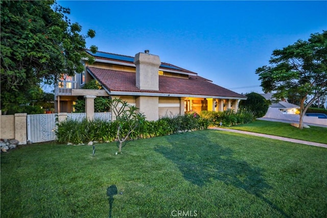 6073 Cameo St, Rancho Cucamonga, CA 91701 - view of front of property featuring a chimney, solar panels, and stucco siding