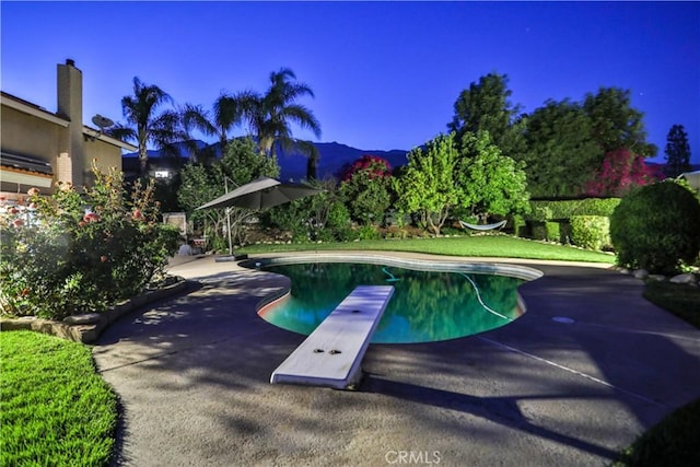 6073 Cameo St, Rancho Cucamonga, CA 91701 - swimming pool featuring a diving board, a patio area, and a mountain view