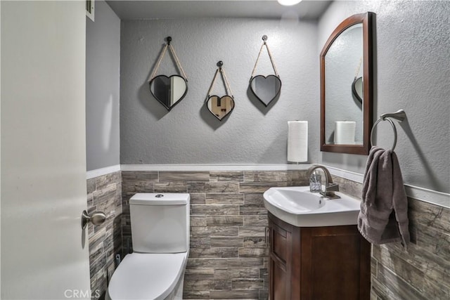 6073 Cameo St, Rancho Cucamonga, CA 91701 - bathroom with tile walls, vanity, and wainscoting