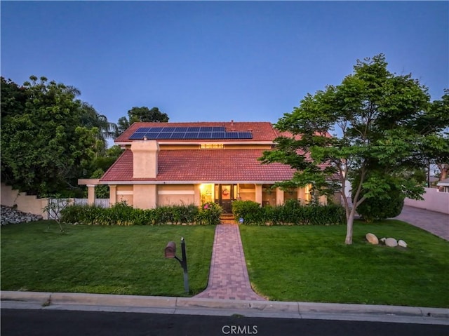 6073 Cameo St, Rancho Cucamonga, CA 91701 - view of front of home featuring a tiled roof, roof mounted solar panels, and stucco siding