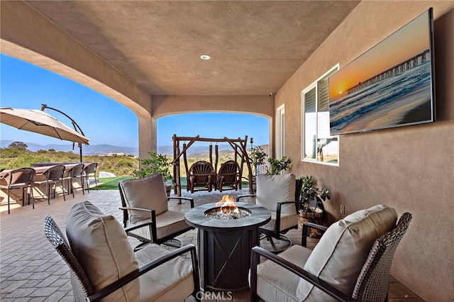 38150 Via Huerta, Murrieta, CA 92562 - view of patio / terrace with an outdoor living space with a fire pit and exterior bar