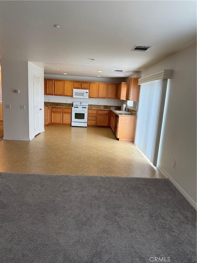 18318 Whitewater Way, Riverside, CA 92508 - kitchen featuring white appliances, recessed lighting, and brown cabinetry